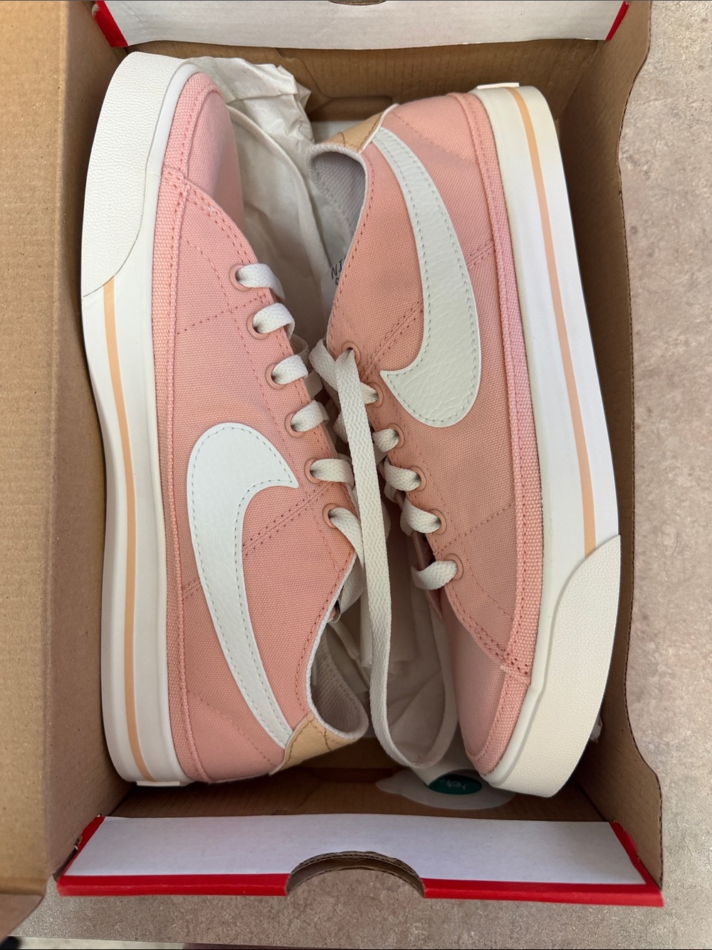 Nike Women's Light Pink Canvas Low-Top Sneakers with White Swoosh